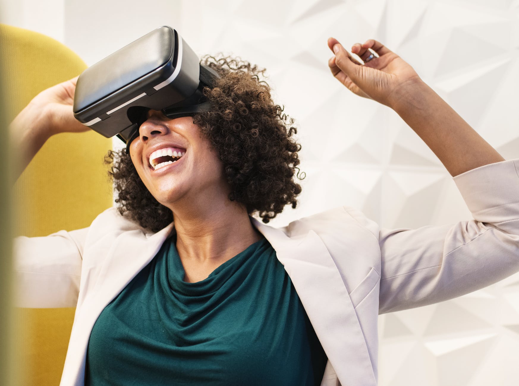 woman smiling using vr goggles